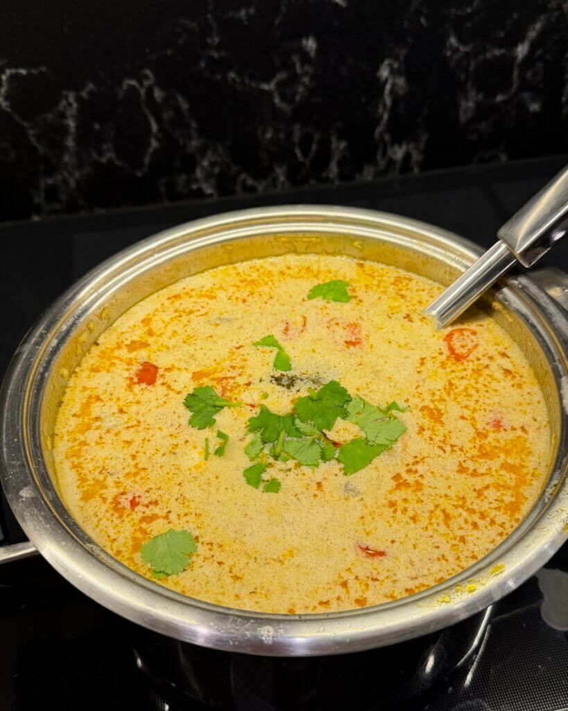 Tom yum seafood soup with shrimp, squid and coconut milk